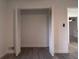 View of the closet featuring wood-look floors and bi-fold doors in a neutrally decorated room at 69 N Hearn Rd, Ellenwood, GA 30294