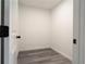 Walk-in closet with gray wood flooring at 69 N Hearn Rd, Ellenwood, GA 30294