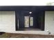A covered front entrance with double doors provides access to the home at 69 N Hearn Rd, Ellenwood, GA 30294