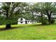Charming two-story home with expansive lawn and mature shade trees at 69 N Hearn Rd, Ellenwood, GA 30294