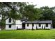 Charming two-story home featuring white brick and siding with a well-manicured lawn at 69 N Hearn Rd, Ellenwood, GA 30294