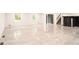 Large finished basement with natural light, stairs, and statement walls at 69 N Hearn Rd, Ellenwood, GA 30294