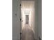 Hallway with hardwood floors and recessed lighting leading to various rooms at 69 N Hearn Rd, Ellenwood, GA 30294