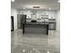 Modern kitchen with an island, stainless steel appliances, and bright white cabinets at 69 N Hearn Rd, Ellenwood, GA 30294