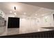Bright, open kitchen featuring stainless steel appliances and a large center island with black countertops at 69 N Hearn Rd, Ellenwood, GA 30294