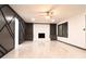 Bright living room with a decorative accent wall, recessed lighting, and a white brick fireplace at 69 N Hearn Rd, Ellenwood, GA 30294