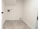 Small empty room with tile floor and neutral walls at 69 N Hearn Rd, Ellenwood, GA 30294