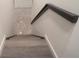 Staircase with hardwood stairs and modern railing down to a lower level at 69 N Hearn Rd, Ellenwood, GA 30294
