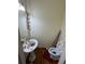 Cozy half-bathroom with a pedestal sink and compact toilet, conveniently located at 71 Southern Golf Ct, Fayetteville, GA 30215