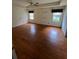Large main bedroom with hardwood floors, tray ceiling, and two windows for ample light at 71 Southern Golf Ct, Fayetteville, GA 30215
