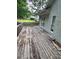 Wood deck featuring ample space for outdoor entertaining and enjoying serene views of the surrounding landscape at 71 Southern Golf Ct, Fayetteville, GA 30215