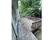 Wood deck offering a private retreat for outdoor dining and relaxation, surrounded by lush greenery at 71 Southern Golf Ct, Fayetteville, GA 30215