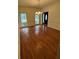 Bright dining room with hardwood floors and large windows offering ample natural light at 71 Southern Golf Ct, Fayetteville, GA 30215