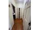 Welcoming hallway with hardwood floors and entry to kitchen area at 71 Southern Golf Ct, Fayetteville, GA 30215