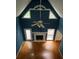 Living room featuring hardwood floors, a fireplace, and vaulted ceilings with bright windows from above at 71 Southern Golf Ct, Fayetteville, GA 30215