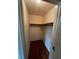 Walk-in closet with wooden floors and a shelf for organization at 71 Southern Golf Ct, Fayetteville, GA 30215