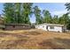 View of the home's backyard, featuring a storage shed and a well-maintained exterior with fresh landscaping at 974 Clydesdale Dr, Marietta, GA 30062