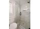 Bathroom showcasing glass shower with gray, marble-look tiling and a window for natural light at 974 Clydesdale Dr, Marietta, GA 30062