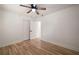 Bedroom with hardwood floors, neutral walls, ceiling fan, and a closet for ample storage at 974 Clydesdale Dr, Marietta, GA 30062