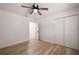Bedroom with hardwood floors, neutral walls, ceiling fan, and a closet for ample storage at 974 Clydesdale Dr, Marietta, GA 30062