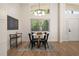 Bright dining area with hardwood floors, a modern chandelier, and natural light from the large window at 974 Clydesdale Dr, Marietta, GA 30062