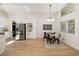 Open concept kitchen and dining area featuring hardwood floors, stainless steel appliances, and modern finishes at 974 Clydesdale Dr, Marietta, GA 30062