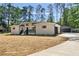 Charming renovated home with fresh white paint, black trim, and a detached two car garage at 974 Clydesdale Dr, Marietta, GA 30062