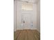 Bright entryway with hardwood floors, a white door with sidelights, and a transom window for natural light at 974 Clydesdale Dr, Marietta, GA 30062