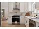 Bright kitchen features white cabinets, stainless steel appliances, and gas cooktop at 974 Clydesdale Dr, Marietta, GA 30062