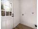 A simple laundry room with a white door at 974 Clydesdale Dr, Marietta, GA 30062