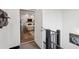 Open-concept living room viewed from the stairway featuring white walls and wood floors at 1200 Ponce De Leon Ne Ave # A1, Atlanta, GA 30306