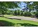 Outdoor basketball court and playground surrounded by trees and green space for recreational activities at 1225 Church St # G, Decatur, GA 30030