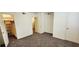 Spacious bedroom with carpet, white walls, walk in closet and two doors at 1225 Church St # G, Decatur, GA 30030