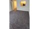 Comfortable living room with soft carpet, neutral paint and a pass-through window to the kitchen at 1225 Church St # G, Decatur, GA 30030