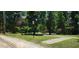 A serene park features lush trees, open green spaces, and walking paths for outdoor enjoyment at 1225 Church St # G, Decatur, GA 30030