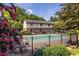 Community pool surrounded by a black metal fence and beautiful trees, offering a relaxing outdoor space at 1225 Church St # G, Decatur, GA 30030