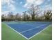 Outdoor tennis court with blue surface and green surroundings, offering a great sports amenity at 1225 Church St # G, Decatur, GA 30030