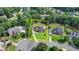 Aerial shot showcasing the property's layout, landscaping, and surrounding neighborhood at 189 Azalea Chase Dr, Suwanee, GA 30024