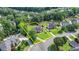 Aerial view of the property highlighting the home, expansive lawn and surrounding trees at 189 Azalea Chase Dr, Suwanee, GA 30024