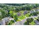 Aerial view of a landscaped property in a neighborhood outlined in yellow at 189 Azalea Chase Dr, Suwanee, GA 30024