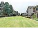 Expansive, well-manicured backyard offering ample green space and privacy at 189 Azalea Chase Dr, Suwanee, GA 30024