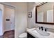 Contemporary bathroom with a white marble countertop and modern fixtures at 189 Azalea Chase Dr, Suwanee, GA 30024