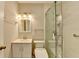 Updated bathroom with a glass-enclosed shower, modern vanity, and brushed gold fixtures at 189 Azalea Chase Dr, Suwanee, GA 30024