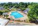 Inviting community pool area with lounge chairs and shaded seating for relaxation at 189 Azalea Chase Dr, Suwanee, GA 30024