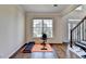 Bright exercise room with a large window and hardwood floors at 189 Azalea Chase Dr, Suwanee, GA 30024