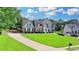 Beautiful two-story home with a large front yard and an extended driveway at 189 Azalea Chase Dr, Suwanee, GA 30024