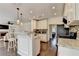 Bright kitchen opens to the living room, featuring granite counters and an eat-in bar at 189 Azalea Chase Dr, Suwanee, GA 30024