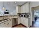 Bright kitchen showcasing granite counters, stainless appliances, and opening to the living room at 189 Azalea Chase Dr, Suwanee, GA 30024