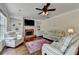 Spacious living room with a fireplace, built-in shelves, and comfortable seating at 189 Azalea Chase Dr, Suwanee, GA 30024