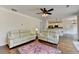 Open living area with hardwood floors and a view of the modern kitchen at 189 Azalea Chase Dr, Suwanee, GA 30024